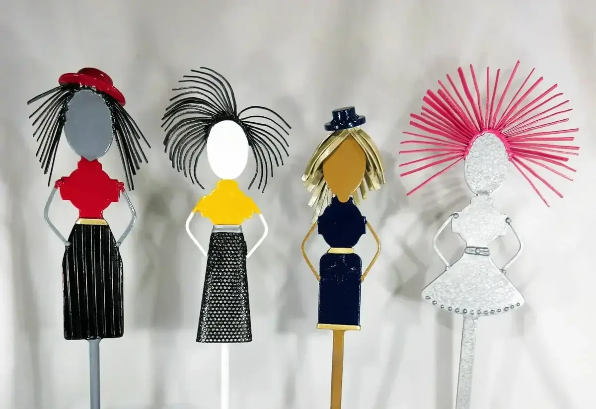 The Sweet Sisters sculptural collection by Michael Herold featuring four character-driven metal sculpture figures presented as a cohesive public art and architectural installation series.