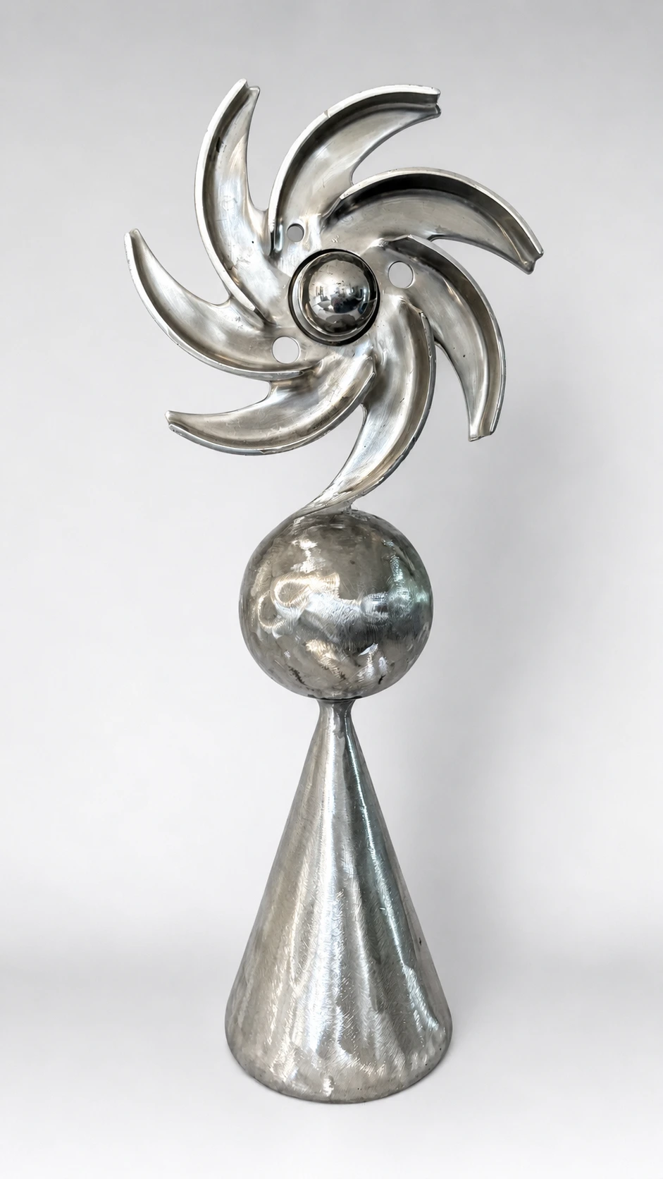 Cone Series sculpture by Michael Herold featuring nested steel spheres contained within a circular halo form above a cone foundation, designed as a monumental public art concept for civic plazas, corporate campuses, hospitality developments, parks, and architectural environments.
