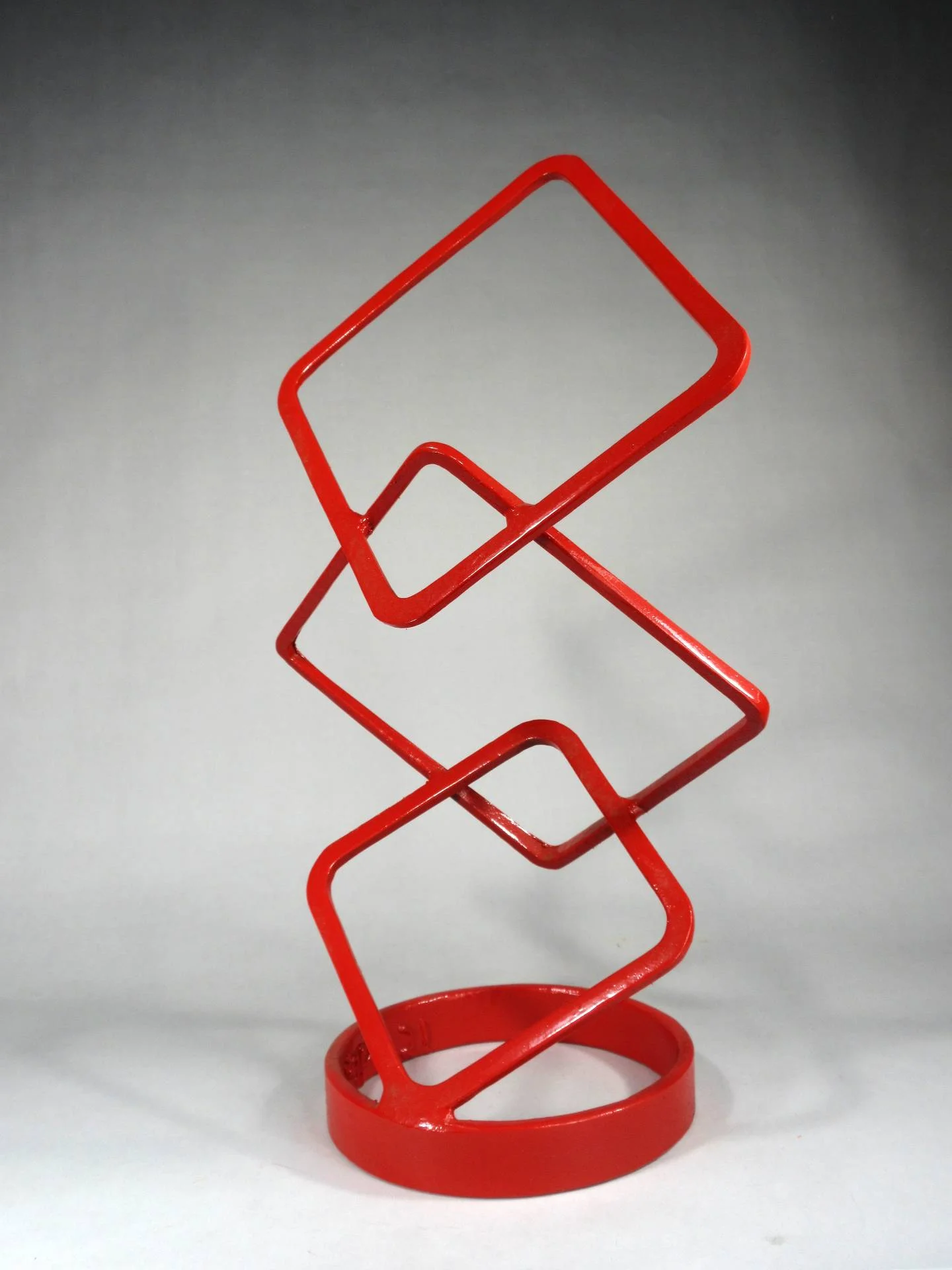 Contemporary geometric steel sculpture with interlocking structural forms designed as a scalable monumental landmark concept for civic plazas, mixed-use developments, and corporate campuses.