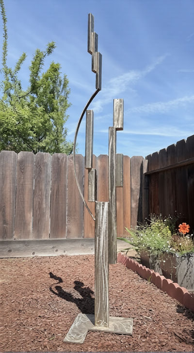Original Floating Trinity stainless steel sculpture by Michael Herold exploring vertical rhythm, elevation, balance, and negative space.