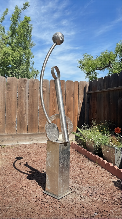 Original vertical steel sculpture titled “Harbor Rise” featuring curved stainless forms and modern architectural composition installed outdoors as a scalable landmark public art concept by sculptor Michael Herold.
