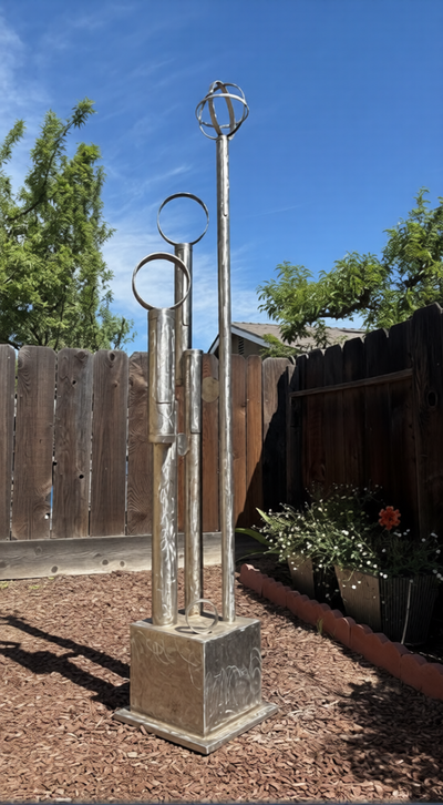 Original Orbital Rising stainless steel sculpture by Michael Herold exploring elevation, proportion, vertical movement, and architectural form.