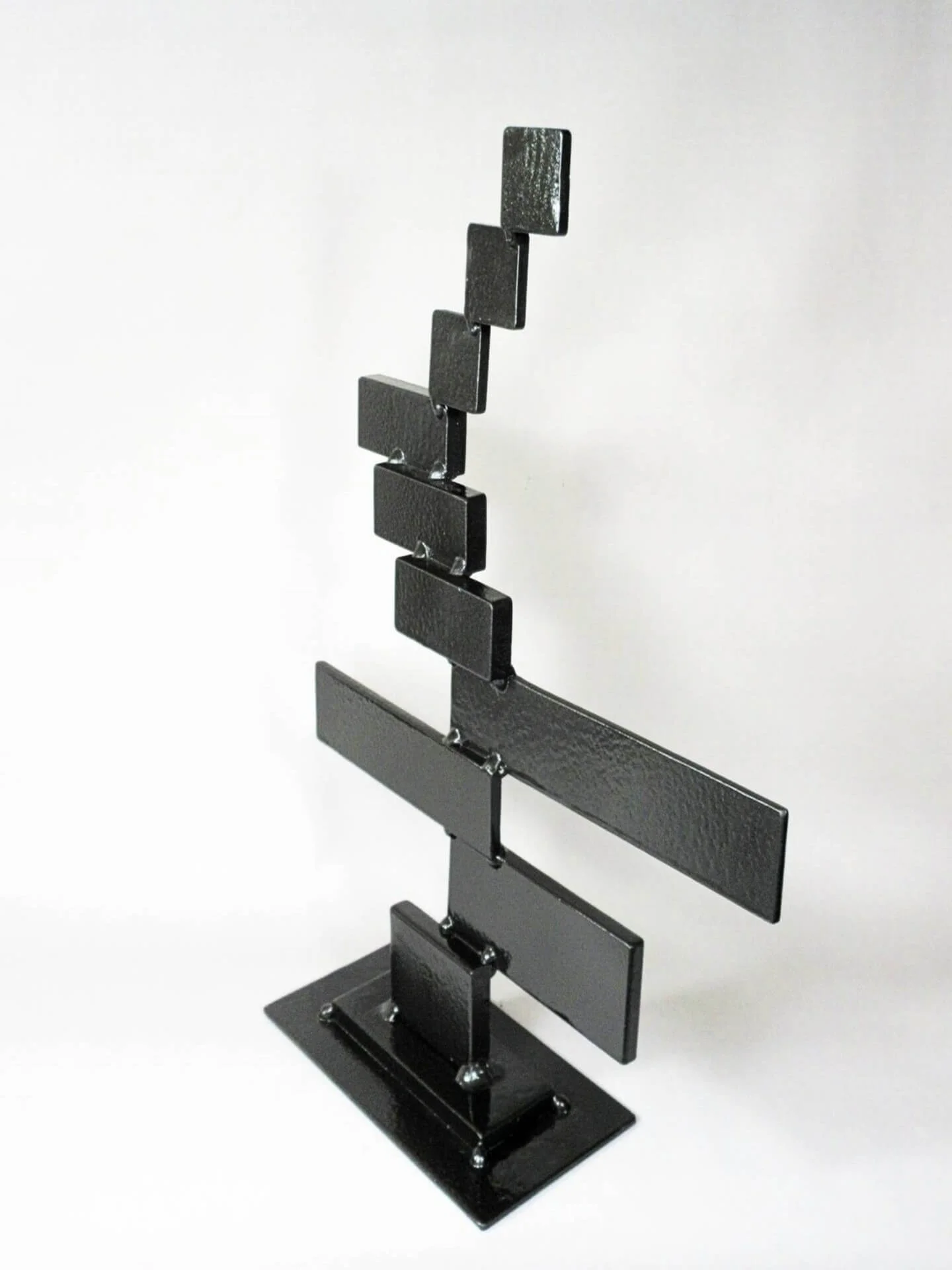 Contemporary geometric steel sculpture titled “Stair Steps” combining linear balance, stepped architectural forms, and minimalist composition developed as a scalable monumental landmark concept for civic plazas and mixed-use developments.