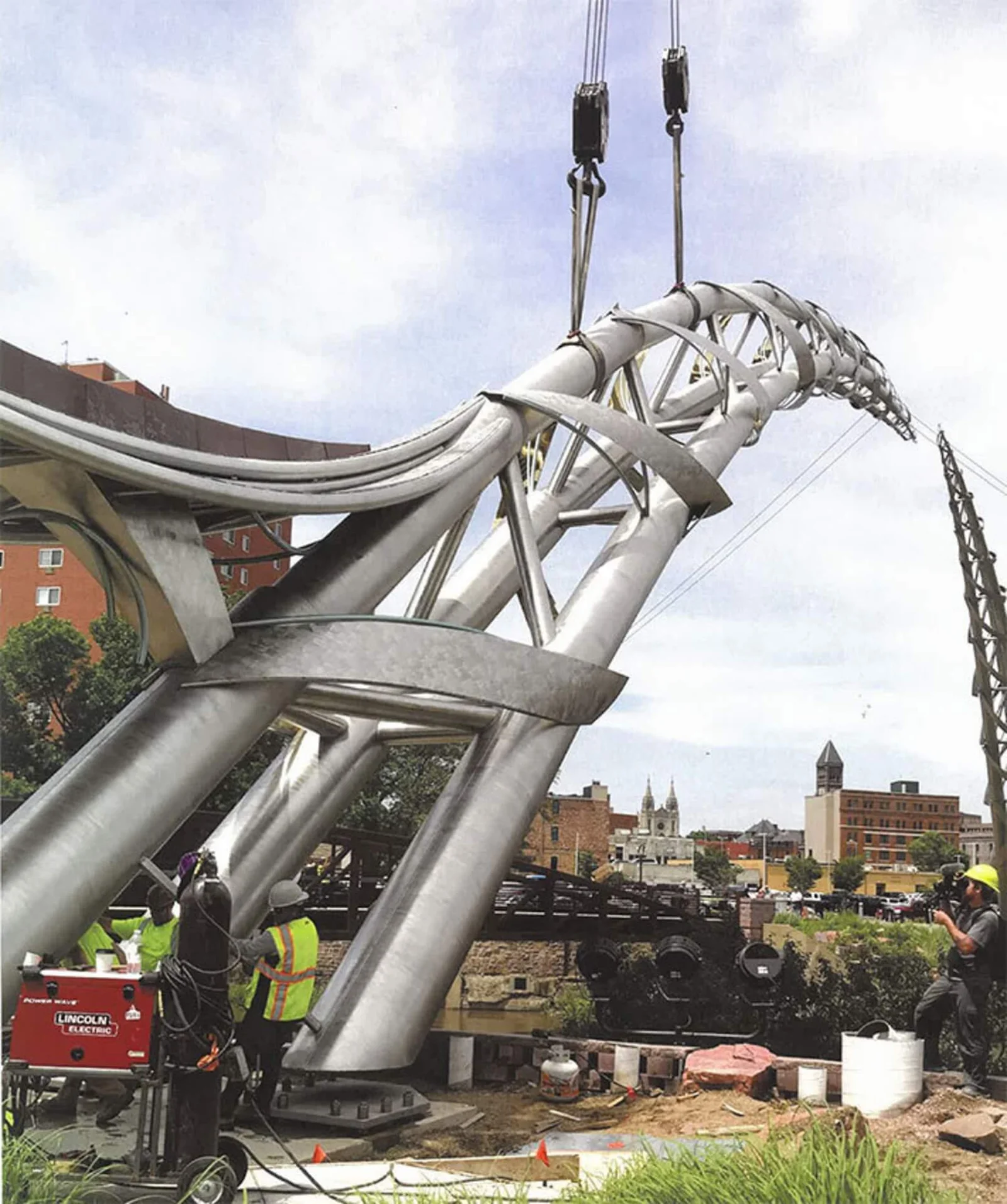 Crane assisted installation of engineered metal sculpture